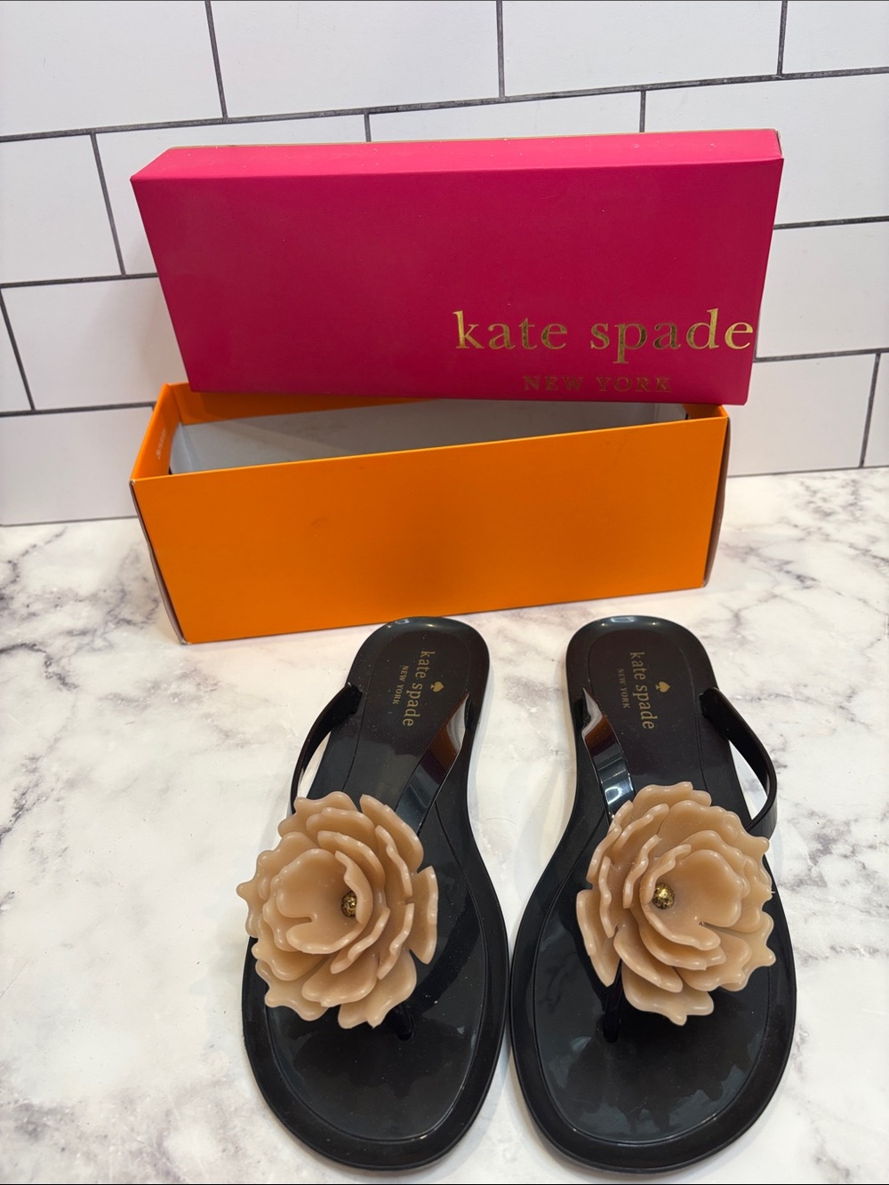 kate spade Black Jelly Flip Sandals with Beige Flower Accent